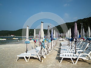 Umbrellas and beach chairs on Koh Larn. PATTAYA, Thailand