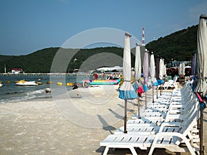 Umbrellas and beach chairs on Koh Larn. PATTAYA, Thailand