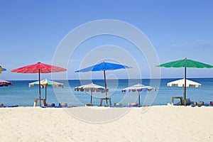 Umbrellas in a beautiful day on Surin beach in Phuket Thailand
