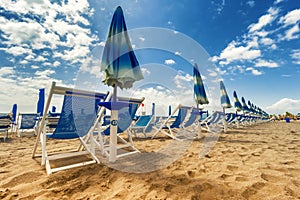 Umbrellas and chairs in Versilia, Italy photo
