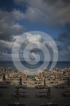 Umbrellas and deck chairs on a sandy beach