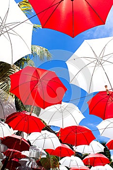 Umbrellas over sky background