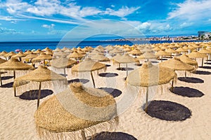 Umbrellas on public beach in Estoril