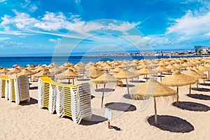 Umbrellas on public beach in Estoril