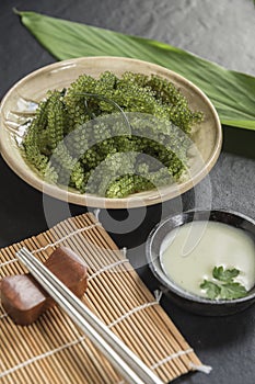 Umi-budou Seaweed or Green Caviar Healthy sea food or sea grapes seaweed on plate