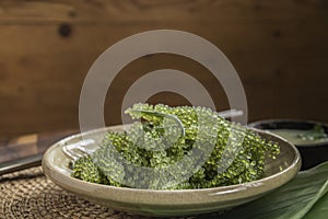 Umi-budou Seaweed or Green Caviar Healthy sea food or sea grapes seaweed on plate