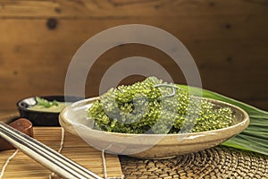 Umi-budou Seaweed or Green Caviar Healthy sea food or sea grapes seaweed on plate