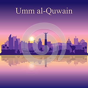 Umm al-Quwain silhouette on sunset background photo