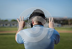 Umpire calling balls and strikes