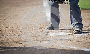 Umpire about to brush the plate