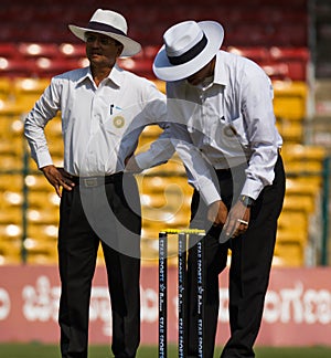 Umpires inspect