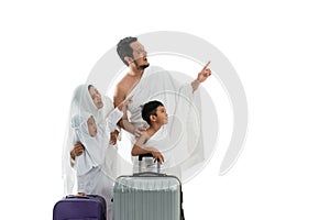 Umrah couple presenting copyspace