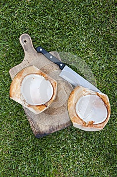 Split coconut and knife photo