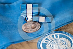 UN Peacekeeper`s medal and service ribbon on blue