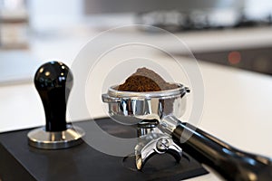 Un-tamped coffee grounds in a portafilter