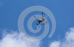 Un undefined air drone flying in the blue sky