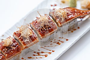 Unagi Sushi : Japanese Rice Wraped Avocado and Cheese Topping with Grilled Unagi Japanese Freshwater Eel and Katsuobushi