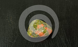 Unakite pebbles green epidote natural mineral stone from Republic of South Africa RSA. Mineralogy, geology, magic of