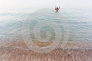 Unattended child bathing in sea