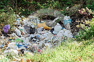 Unauthorized pile of garbage in the city of recreation in nature. Barbarism of people.