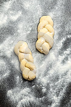 Unbaked braided bun dough. Raw dough