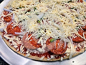 Unbaked Thin Crust Pepperoni Pizza photo