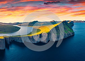 Unbelievable evening view from flying drone of Sorvagsvatn lake, Vagar, Faroe Islands, Denmark, Europe. Wonderful summer sunset on