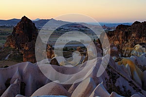 Unbelievable landscape of shaped sandstone rocks duringt sunset. Typical geologic formations of Cappadocia