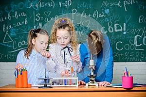 It is unbelievable. Little children at laboratory. Little kids learning chemistry in school lab. students do biology