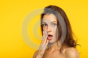 Unbelievable shocked surprised woman cover mouth