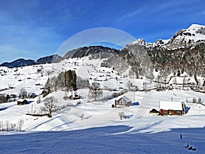 Unbelievably beautiful winter atmosphere on the pastures and hills of the Swiss Alps in the Obertoggenburg region, Unterwasser