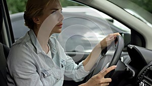 Unbelted woman driving car, risk of accident, traffic rules and regulations