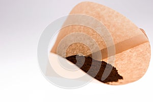 Paper coffee filter with ground coffee