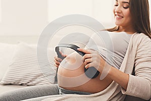 Unborn baby listening music in mother`s belly