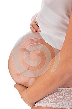 Unborn baby in pregnant belly photo