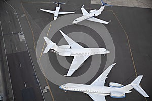 Unbranded aeroplanes waiting on runway