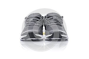 Unbranded black sport running shoes or sneakers isolated on white background.