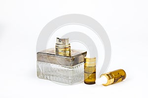 Unbranded perfume spray bottle and two bottles of hyaluronic acid with pipette on white background. Bottles for branding and label