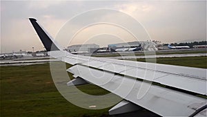 Unbranded plane landing wing view