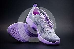 Unbranded purple running shoes on a black background