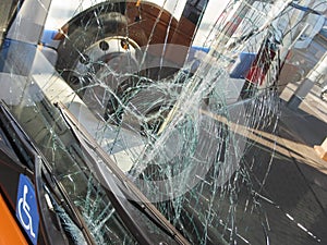 Unbreakable frontal glass damaged by crash in a public transport