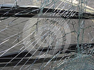 Unbreakable frontal glass damaged by crash in a public transport