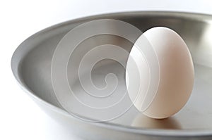 Unbroken Egg on a Pan