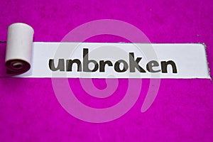 Unbroken text, Inspiration, Motivation and business concept on purple torn paper