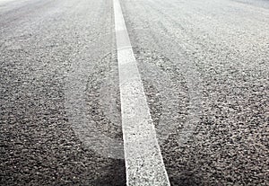 Unbroken white road marking line