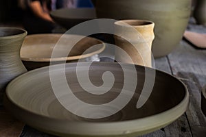 Unburned clay vessels on table