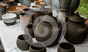 Unburned clay vessels on table