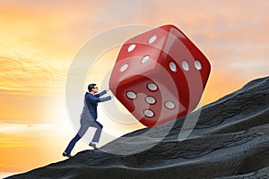 Uncertainty concept with businessman and dice