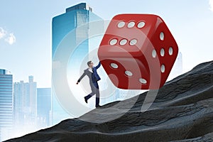 Uncertainty concept with businessman and dice