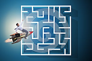 The uncertainty concept with businessman lost in maze labyrinth